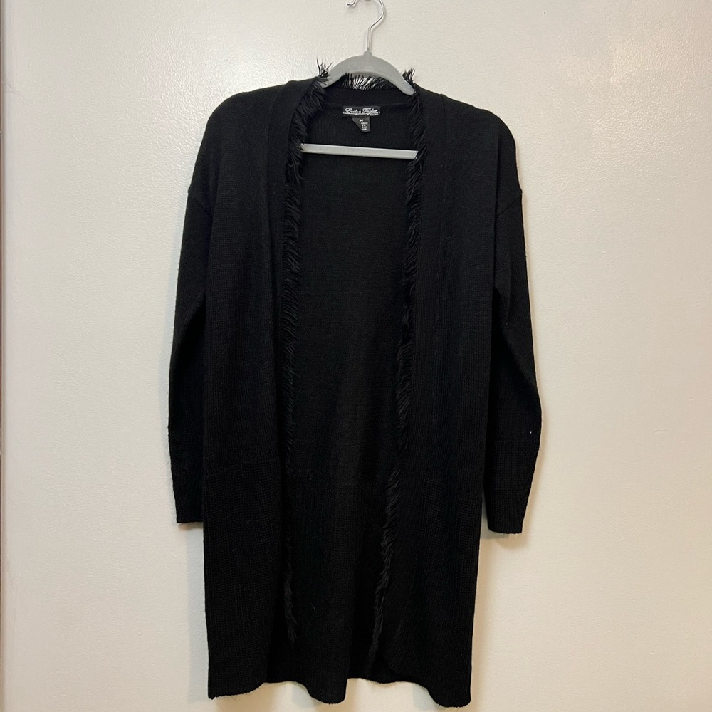 A Black long cardigan medium fits like a medium could be worn smaller or bigger